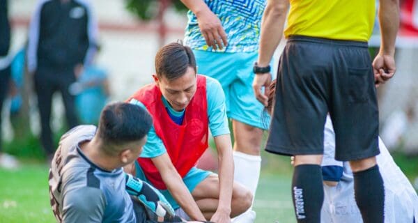 Soccer Player Injury Assistance on Field