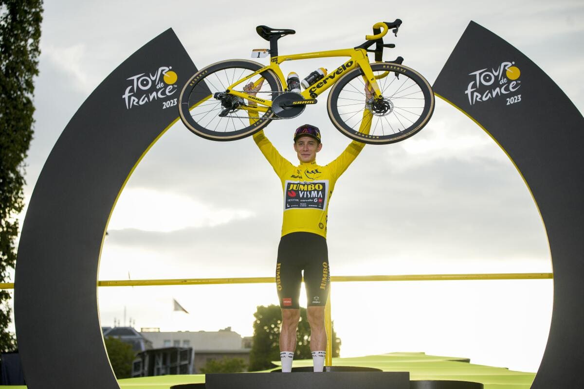 Tour de France Winners Cyclist celebrating victory with bicycle