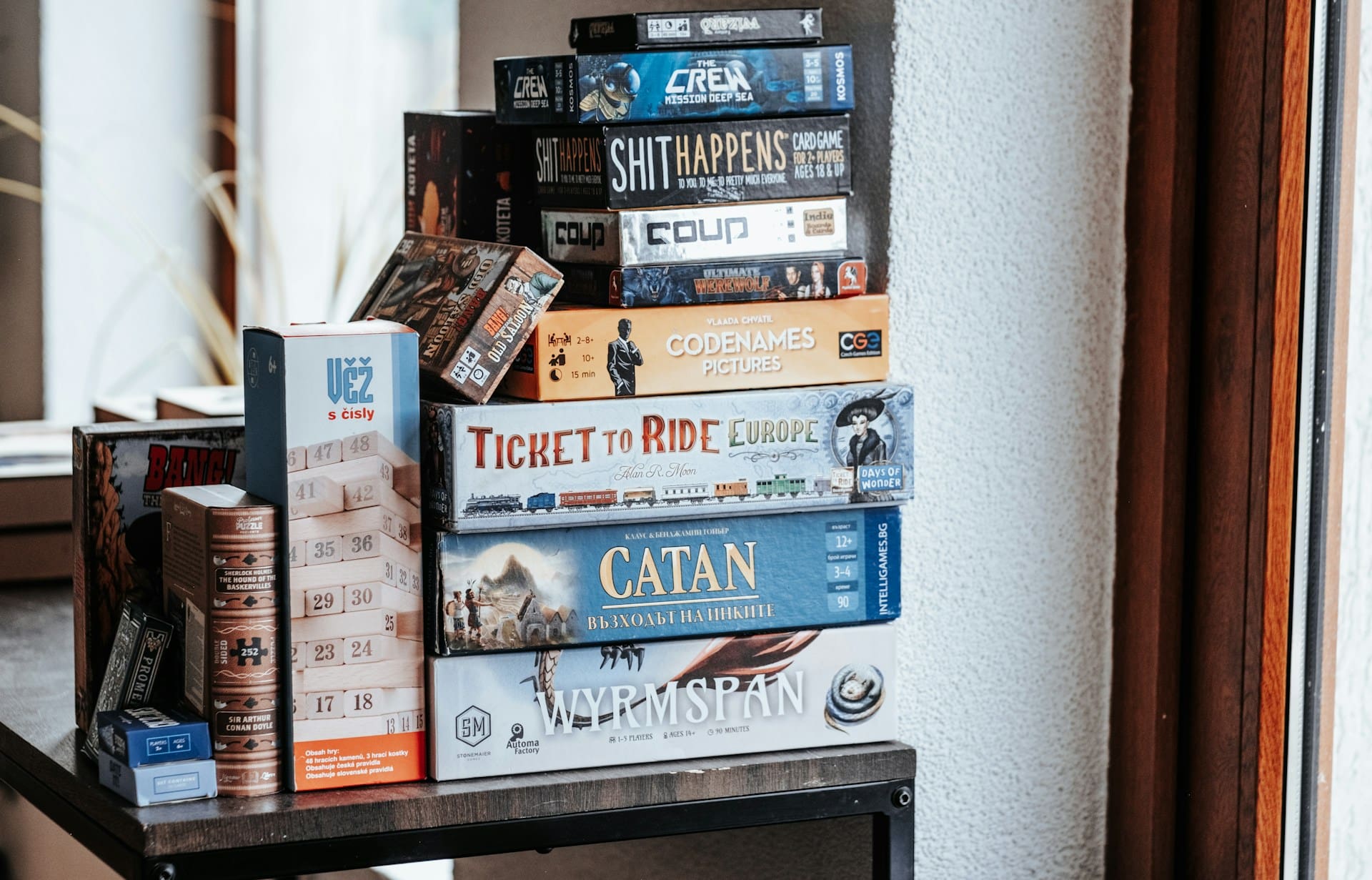 Board games are stacked on a shelf Board games are stacked on a shelf