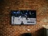 How Sports Became a Key Part of Modern Entertainment Culture black flat screen tv mounted on brown brick wall