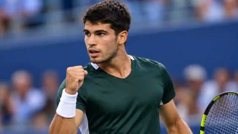 Carlos Alcaraz celebrates during a tennis match