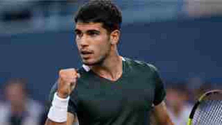 Carlos Alcaraz celebrates during a tennis match