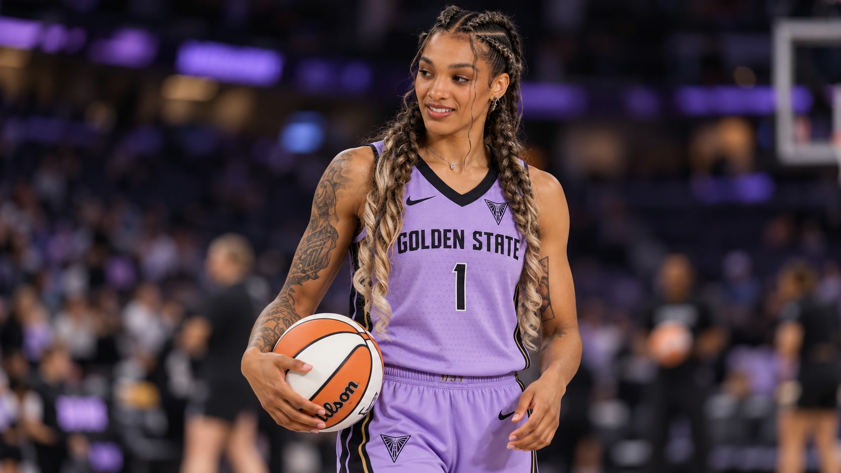 Gabby Williams Gabby Williams in a lavender Golden State Valkyries No. 1 uniform holding a basketball.