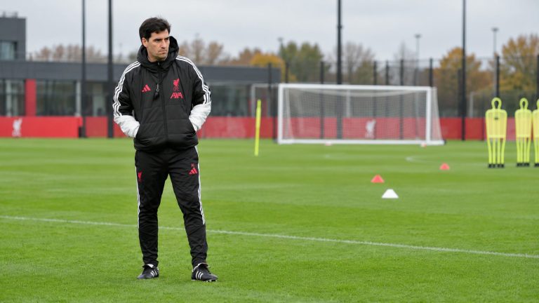 AI-generated editorial image of Andoni Iraola in Liverpool Adidas coaching kit on a football training pitch