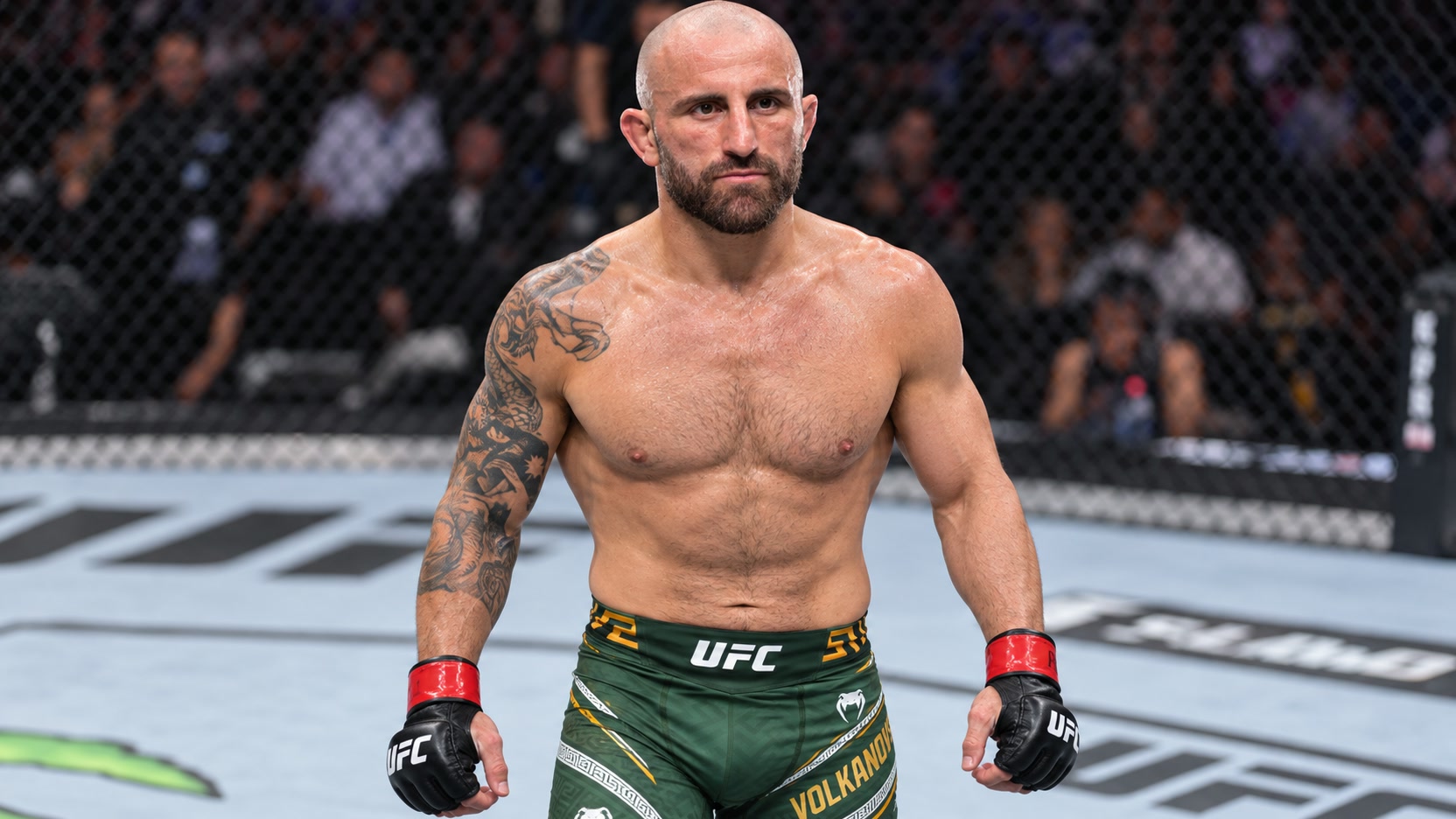 Alexander Volkanovski in green and gold shorts and black UFC gloves with red wrist tape inside an MMA cage.